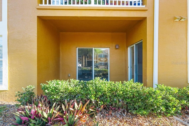 entrance to property featuring a balcony