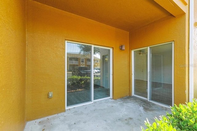 doorway to property featuring a patio area