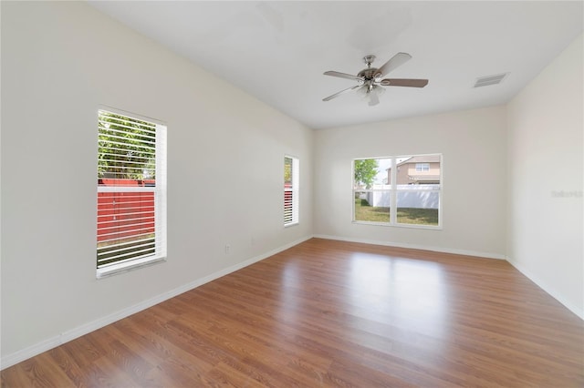 unfurnished room featuring light hardwood / wood-style flooring and ceiling fan