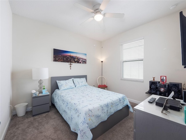 bedroom featuring ceiling fan and dark colored carpet