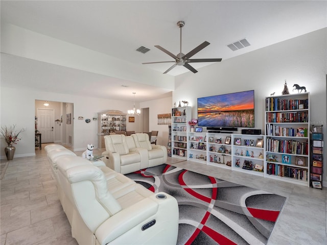 living room with ceiling fan with notable chandelier and light tile flooring