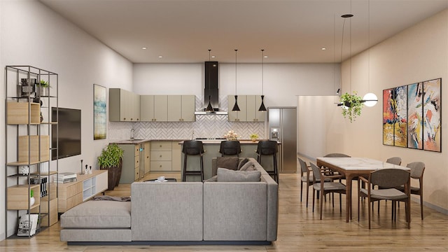 living room featuring light hardwood / wood-style floors and sink