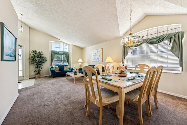 carpeted dining room featuring a textured ceiling, vaulted ceiling, and an inviting chandelier