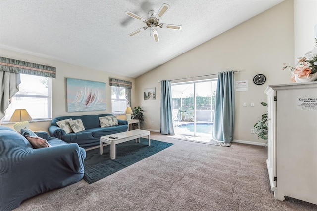 living room featuring light carpet, lofted ceiling, ceiling fan, and a textured ceiling