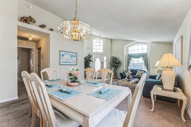 dining area featuring lofted ceiling, dark carpet, an inviting chandelier, and a textured ceiling