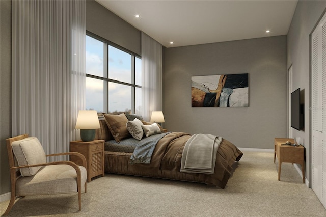 bedroom featuring a closet and light colored carpet