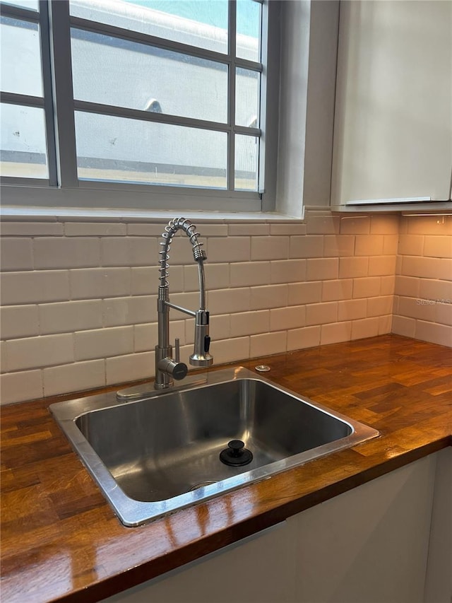 details featuring backsplash and sink