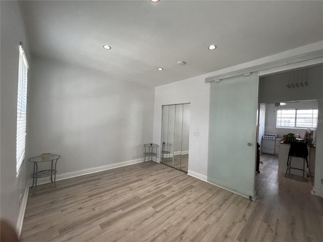 empty room with hardwood / wood-style floors