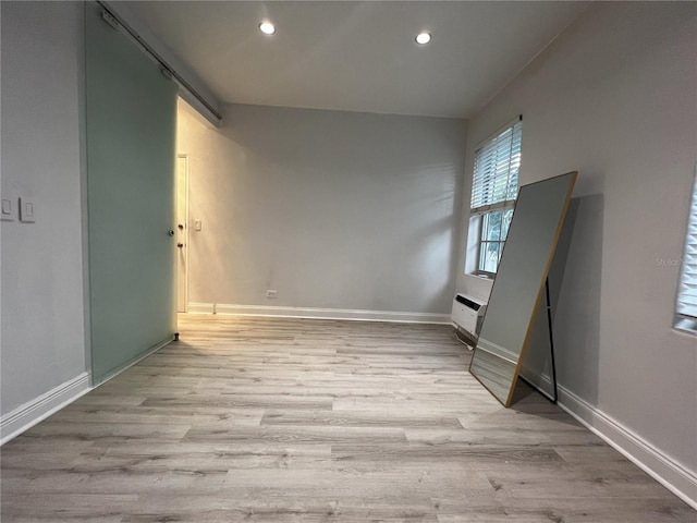 spare room featuring light wood-type flooring