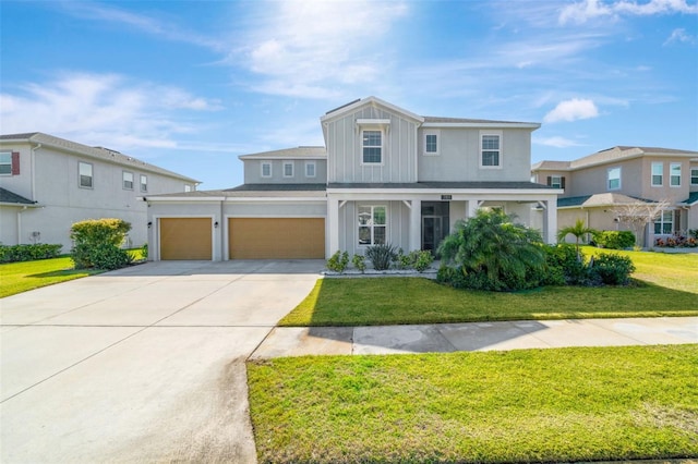 view of front facade featuring a front lawn and a garage