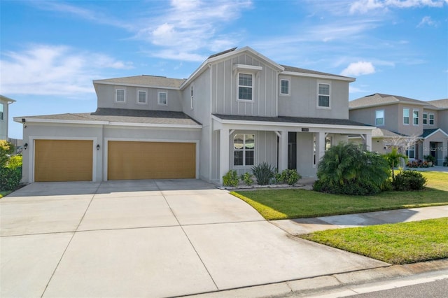 view of front of home with a garage and a front lawn