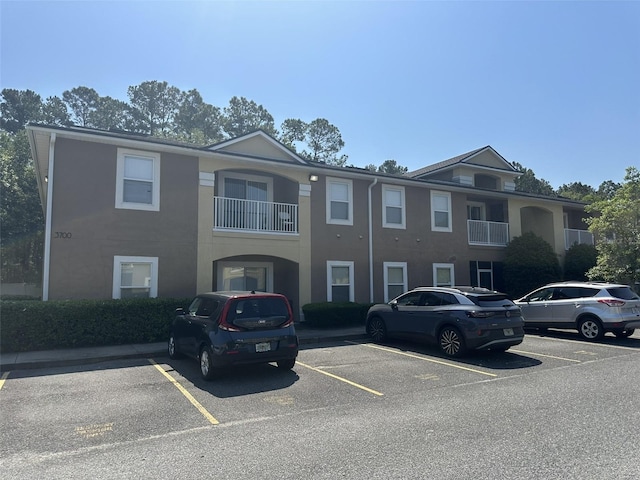 view of front of property with a balcony