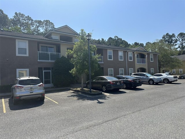 view of front of property with a balcony