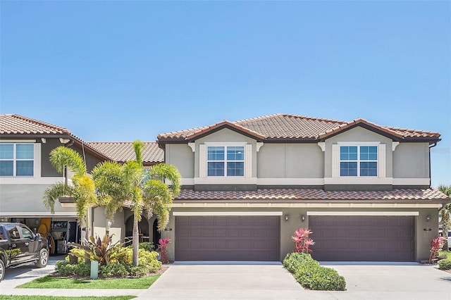 mediterranean / spanish-style home featuring a garage