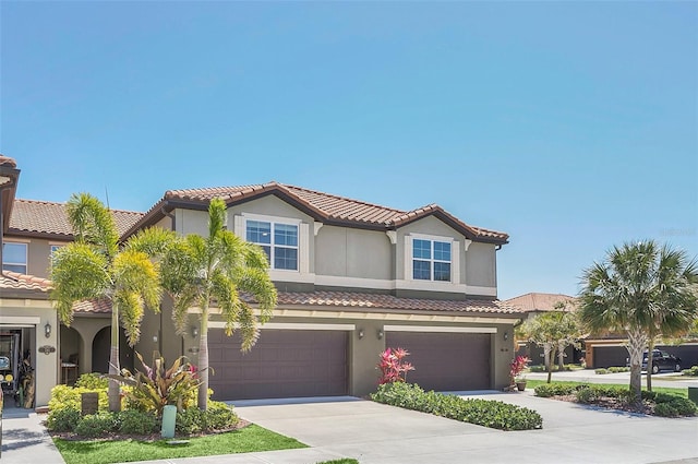 mediterranean / spanish house featuring a garage