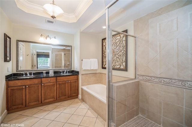 bathroom featuring tile floors, large vanity, a raised ceiling, dual sinks, and independent shower and bath