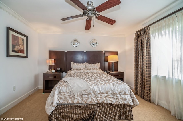 bedroom with ornamental molding, light carpet, ceiling fan, and multiple windows