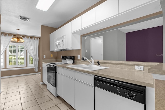 kitchen with white appliances, white cabinetry, an inviting chandelier, sink, and light tile floors