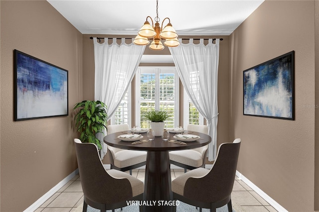 dining room featuring baseboards, an inviting chandelier, and light tile patterned floors