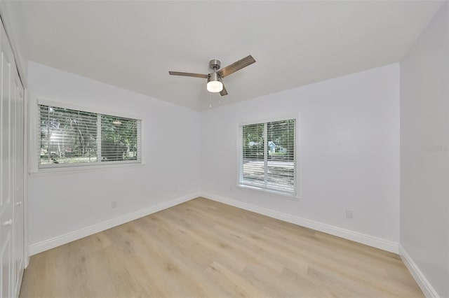 spare room featuring ceiling fan and light wood-type flooring