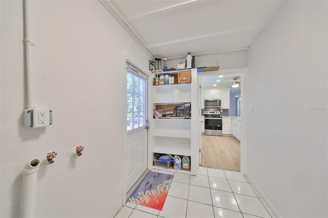 bathroom featuring hardwood / wood-style flooring and ornamental molding