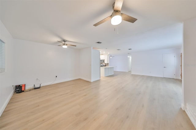 interior space with ceiling fan and light wood-type flooring