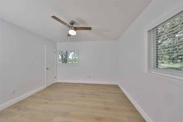 spare room featuring ceiling fan and light hardwood / wood-style floors