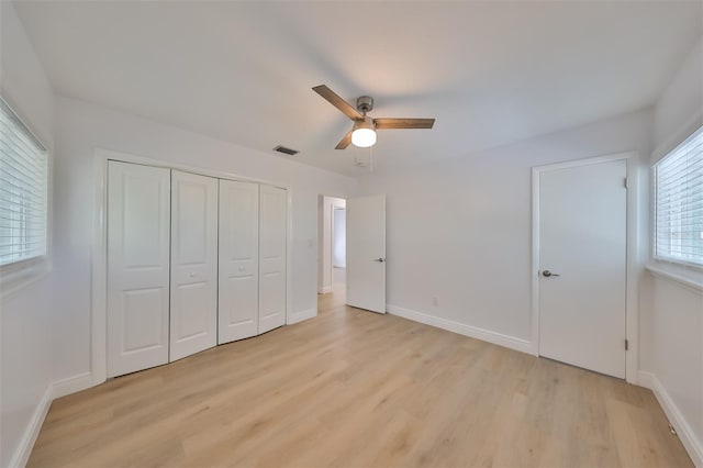 unfurnished bedroom with light hardwood / wood-style floors and ceiling fan