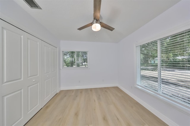 unfurnished bedroom featuring a closet, ceiling fan, and light hardwood / wood-style floors