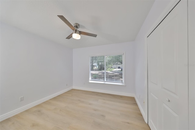 unfurnished bedroom with a closet, ceiling fan, and light wood-type flooring