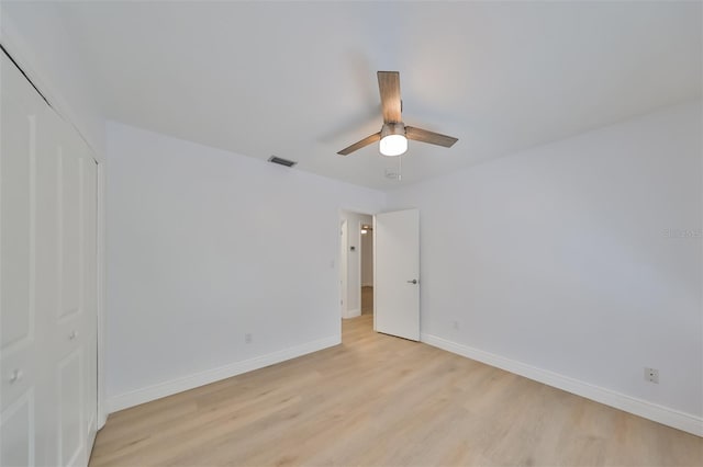 spare room with light hardwood / wood-style floors and ceiling fan