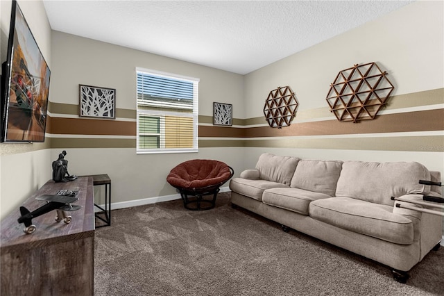 living room featuring a textured ceiling and dark colored carpet