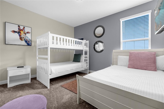 bedroom featuring dark colored carpet