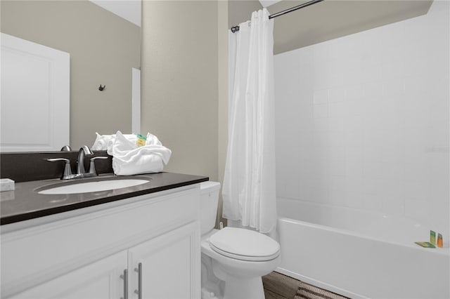 full bathroom featuring wood-type flooring, shower / bath combination with curtain, oversized vanity, and toilet