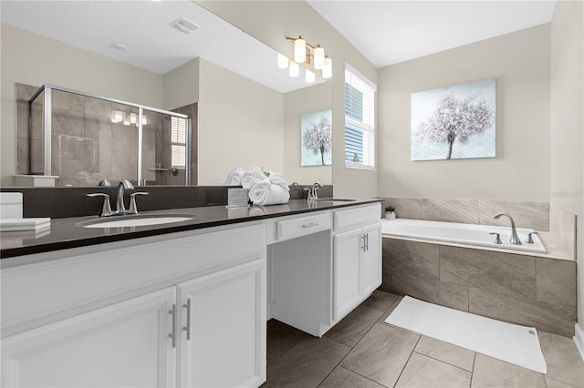 bathroom featuring tile floors, separate shower and tub, large vanity, and double sink