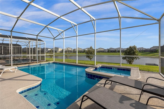 view of pool with a patio area, a lanai, and an in ground hot tub