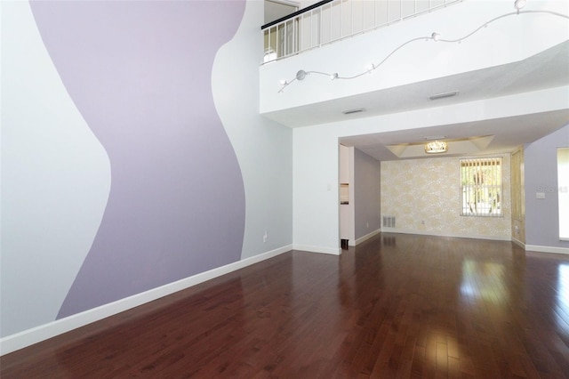 unfurnished room featuring dark wood-type flooring