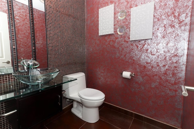 bathroom featuring tile patterned floors, vanity, and toilet