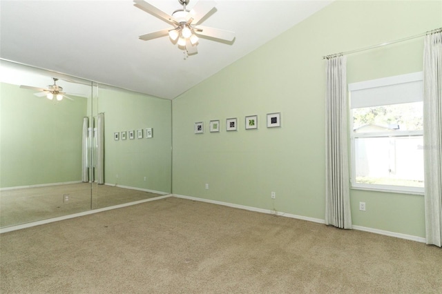 interior space with ceiling fan and lofted ceiling