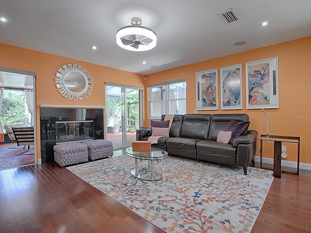 living room featuring dark wood-type flooring