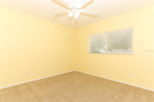 carpeted empty room with ceiling fan