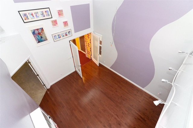 staircase featuring hardwood / wood-style floors