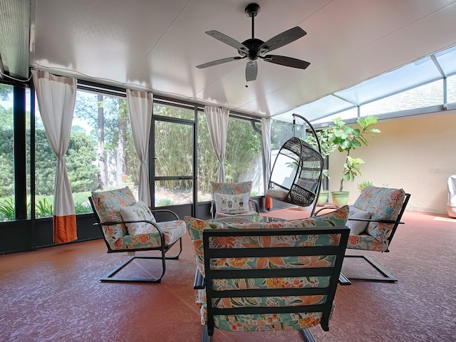 sunroom / solarium featuring ceiling fan