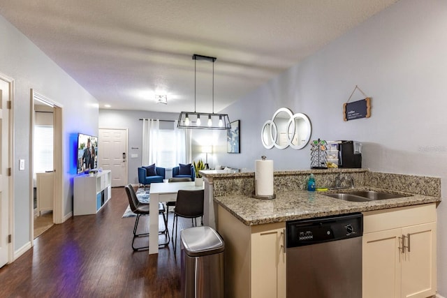 kitchen with a breakfast bar area, dark wood-type flooring, stainless steel dishwasher, decorative light fixtures, and light stone countertops