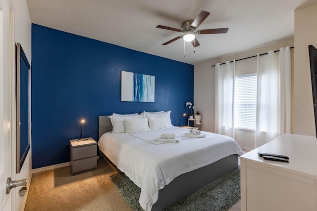 bedroom featuring ceiling fan and carpet floors