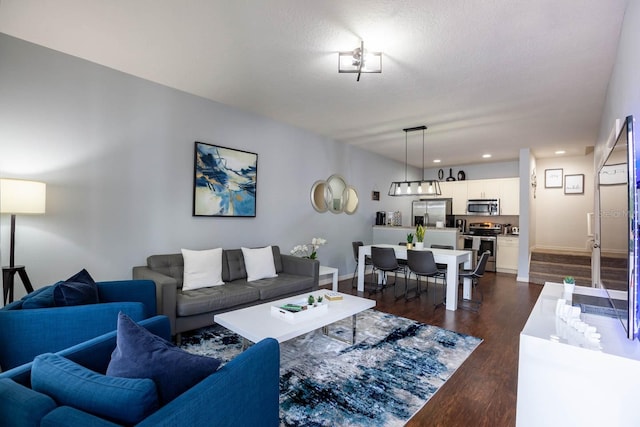 living room with dark hardwood / wood-style floors