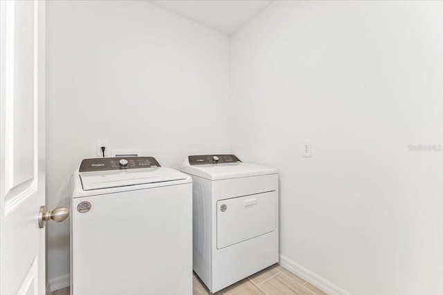 clothes washing area featuring washing machine and clothes dryer