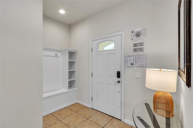 entrance foyer featuring light tile floors