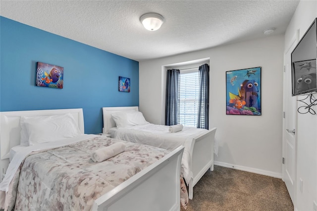 carpeted bedroom featuring a textured ceiling