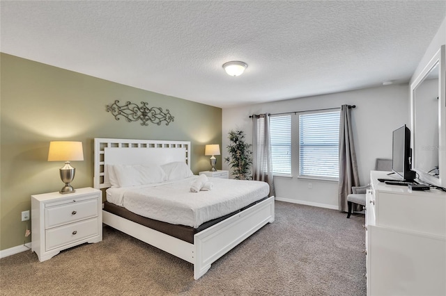 carpeted bedroom featuring a textured ceiling